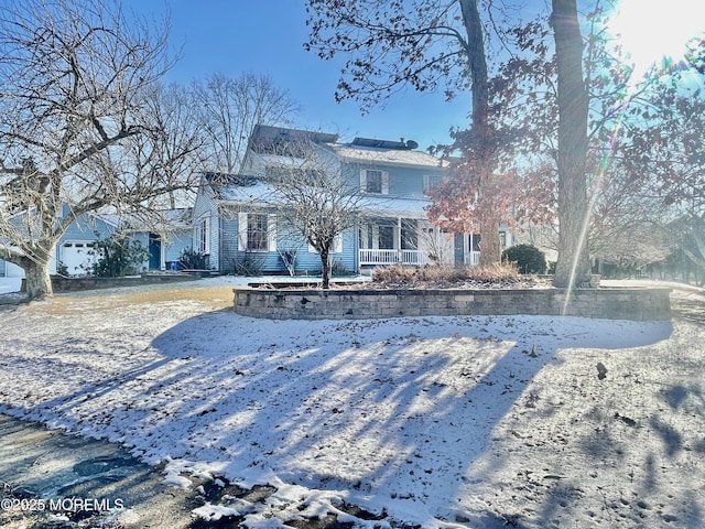 view of snow covered house