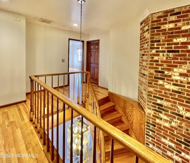 stairway with hardwood / wood-style flooring