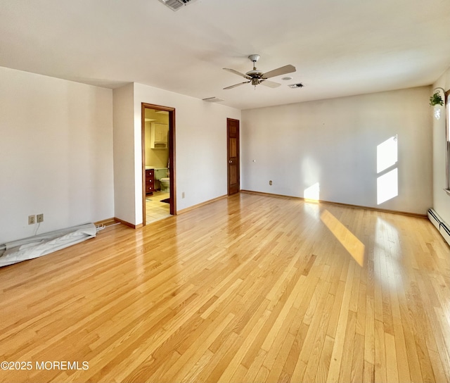 empty room with light hardwood / wood-style floors and ceiling fan