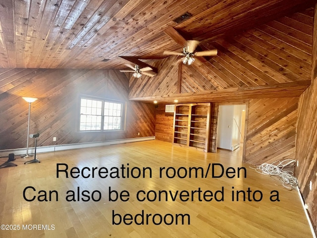 bonus room featuring vaulted ceiling, wood-type flooring, wooden ceiling, and wood walls