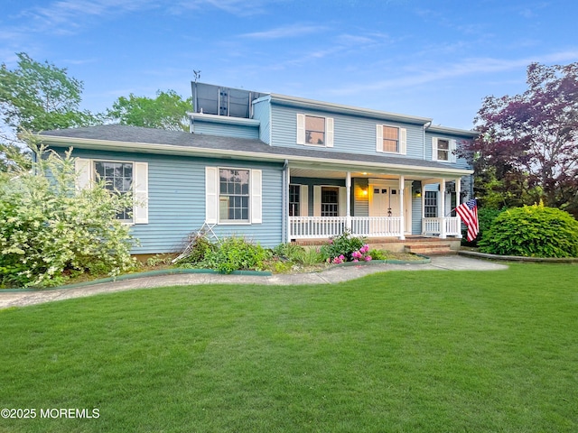 705 Princeton Rd, Lanoka Harbor, NJ 08734 - traditional-style house featuring a porch and a front lawn