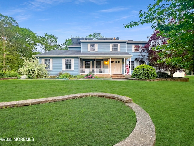 705 Princeton Rd, Lanoka Harbor, NJ 08734 - view of front facade featuring covered porch and a front yard