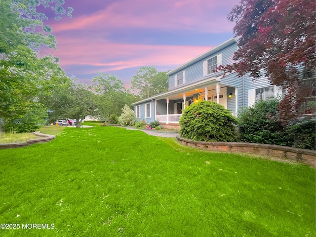 705 Princeton Rd, Lanoka Harbor, NJ 08734 - yard at dusk with covered porch and a yard