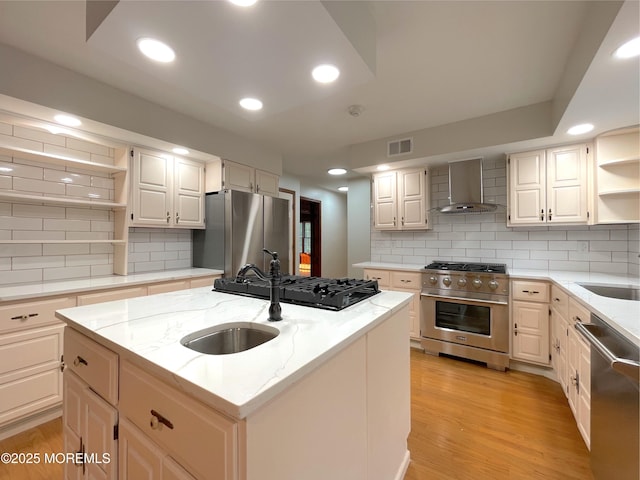 705 Princeton Rd, Lanoka Harbor, NJ 08734 - kitchen with stainless steel appliances, wall chimney range hood, open shelves, a center island with sink, and tasteful backsplash