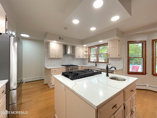 705 Princeton Rd, Lanoka Harbor, NJ 08734 - kitchen featuring a sink, freestanding refrigerator, baseboard heating, wall chimney range hood, and light wood-type flooring