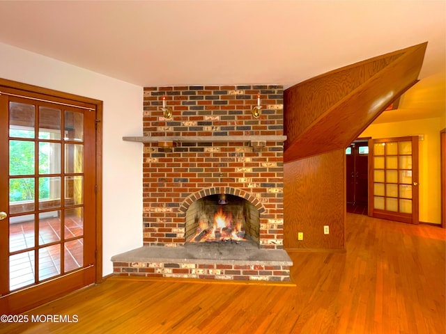 705 Princeton Rd, Lanoka Harbor, NJ 08734 - unfurnished living room featuring wood finished floors and a fireplace