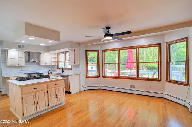 705 Princeton Rd, Lanoka Harbor, NJ 08734 - kitchen with wall chimney exhaust hood, a sink, light countertops, light wood-type flooring, and recessed lighting