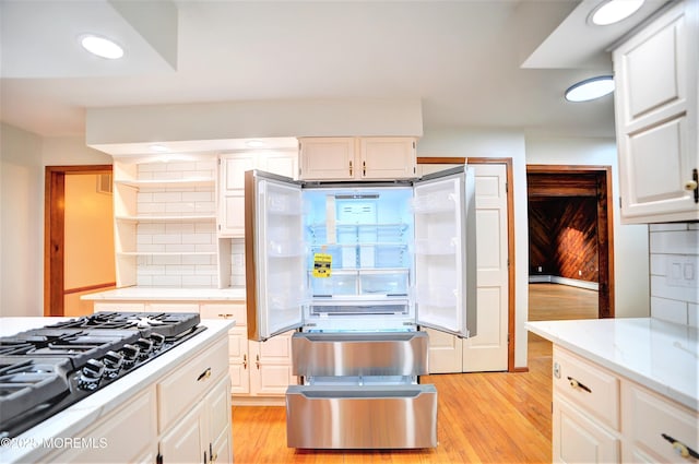 705 Princeton Rd, Lanoka Harbor, NJ 08734 - kitchen with black gas stovetop, light wood-style flooring, tasteful backsplash, white cabinets, and recessed lighting