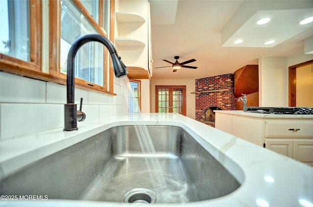 705 Princeton Rd, Lanoka Harbor, NJ 08734 - kitchen view of recessed lighting, ceiling fan, a sink, light countertops, and tasteful backsplash