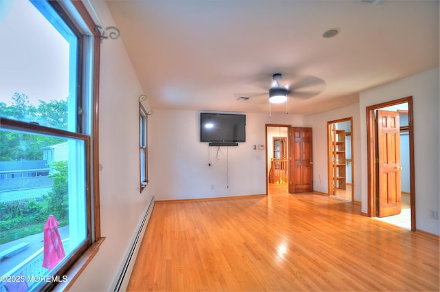 705 Princeton Rd, Lanoka Harbor, NJ 08734 - unfurnished living room with light wood-style floors, a ceiling fan, a baseboard radiator, and baseboards