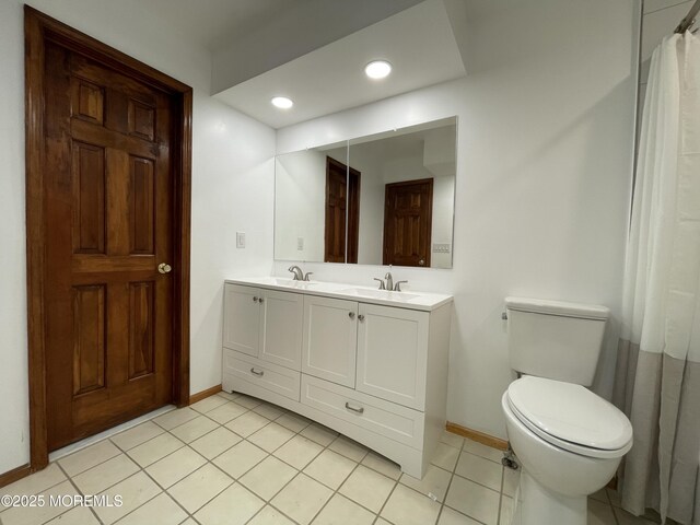 705 Princeton Rd, Lanoka Harbor, NJ 08734 - bathroom with baseboards, double vanity, tile patterned floors, toilet, and recessed lighting