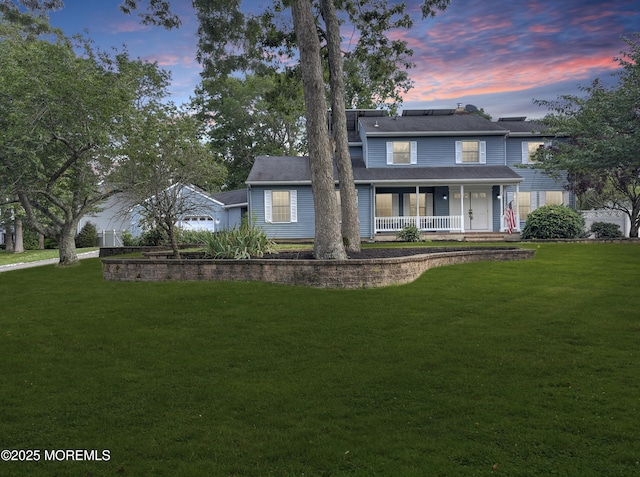 705 Princeton Rd, Lanoka Harbor, NJ 08734 - traditional-style home featuring covered porch, solar panels, and a yard