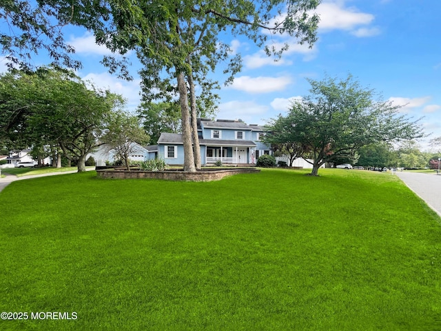 705 Princeton Rd, Lanoka Harbor, NJ 08734 - view of front of property with covered porch and a front lawn