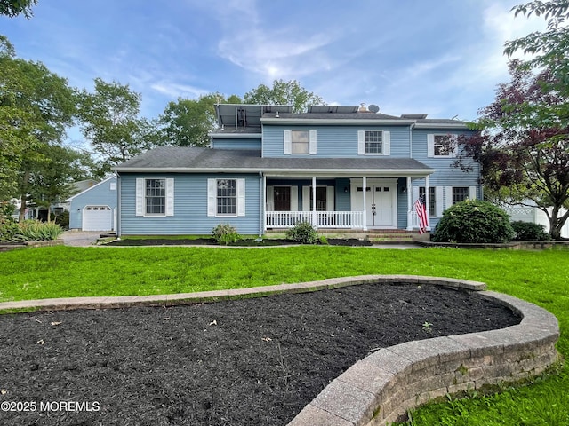 705 Princeton Rd, Lanoka Harbor, NJ 08734 - view of front facade featuring a porch, a front yard, and a detached garage