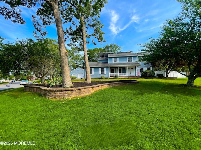 705 Princeton Rd, Lanoka Harbor, NJ 08734 - view of front of house with covered porch, a front yard, and roof mounted solar panels