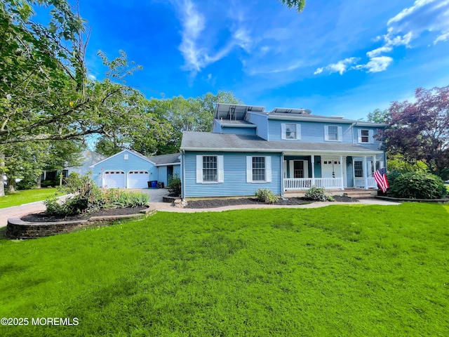 705 Princeton Rd, Lanoka Harbor, NJ 08734 - view of front of house with covered porch, a front lawn, a detached garage, and driveway