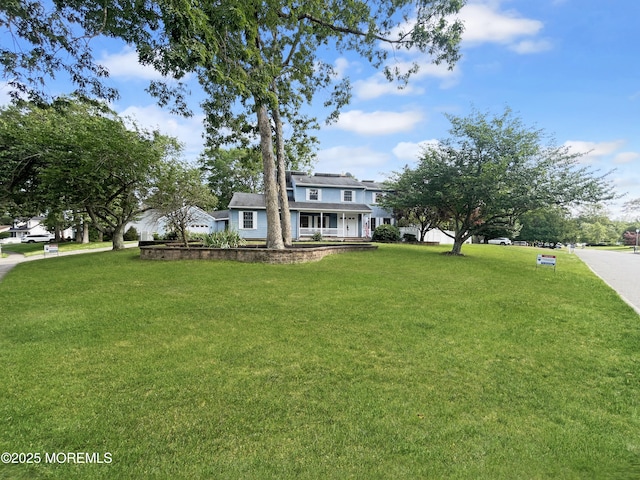 705 Princeton Rd, Lanoka Harbor, NJ 08734 - view of front facade featuring a porch and a front lawn