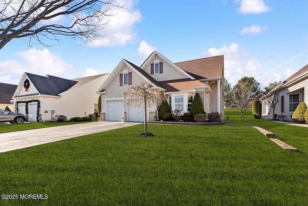 view of front of home featuring a garage and a front lawn