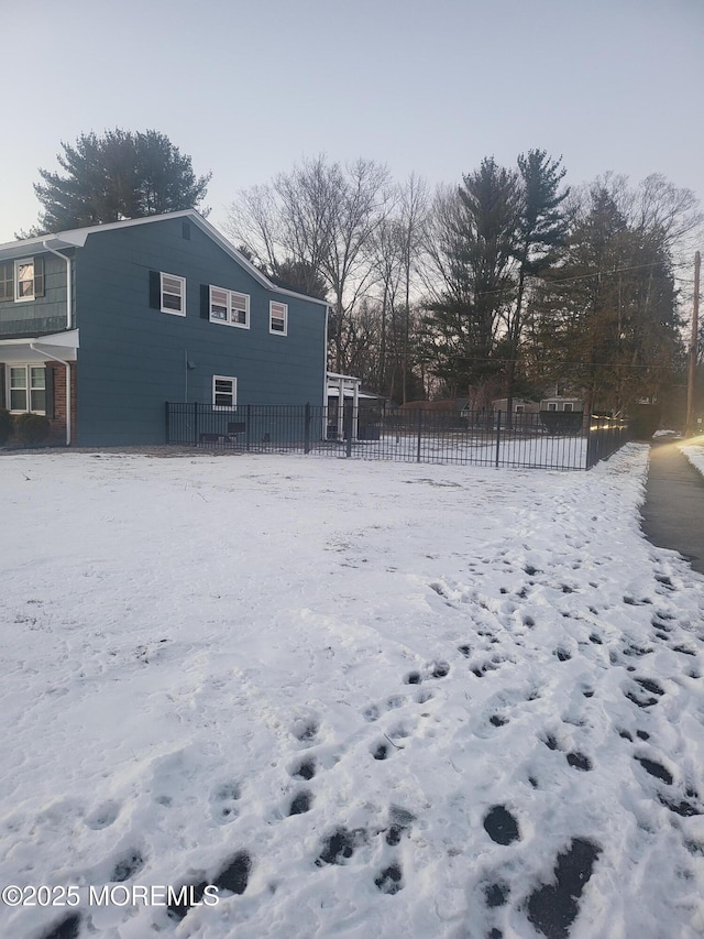 view of yard layered in snow