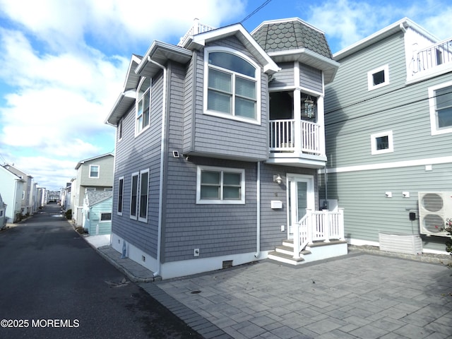 back of property featuring a patio