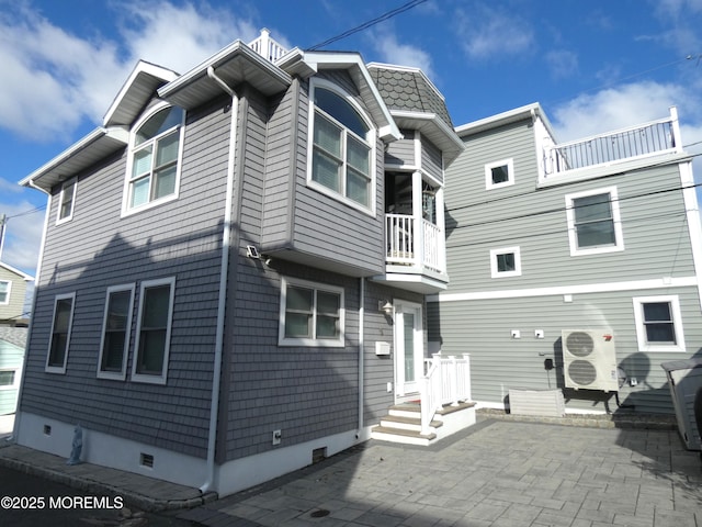 rear view of property with a patio area