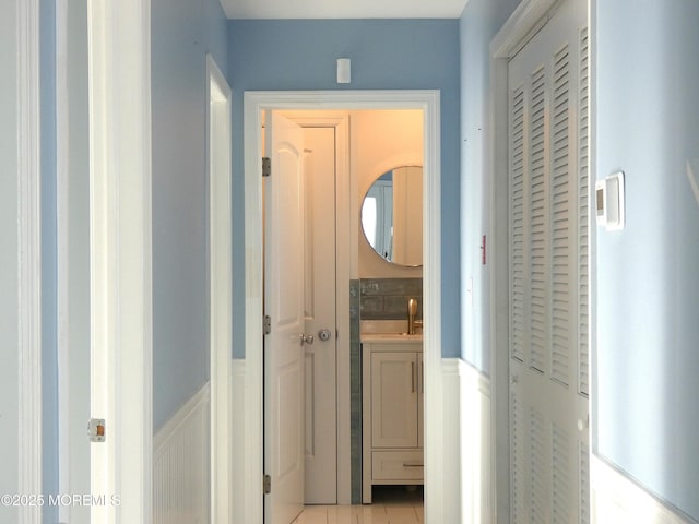 corridor featuring light tile patterned flooring