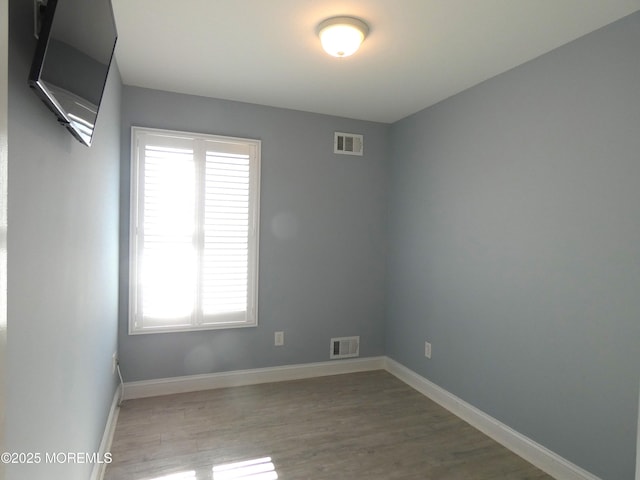 empty room featuring hardwood / wood-style floors