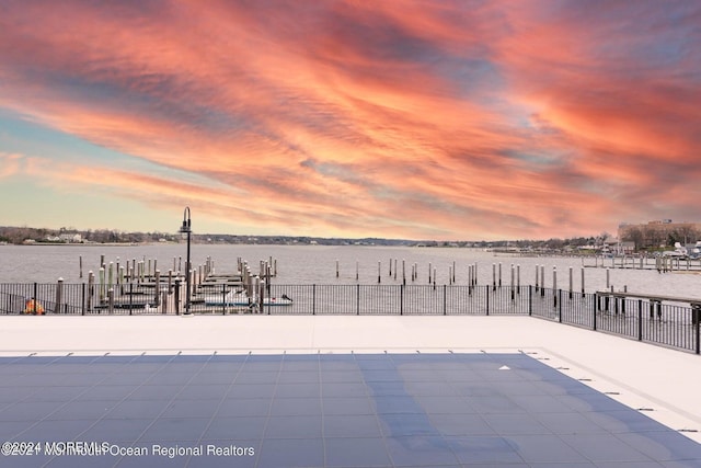 patio terrace at dusk with a water view