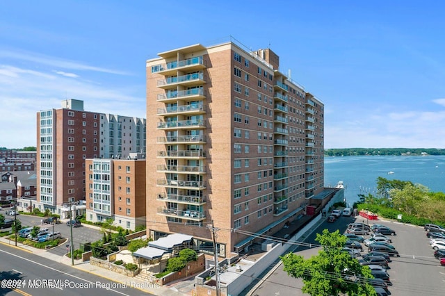 view of property with a water view