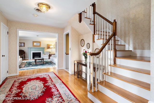 entryway with light hardwood / wood-style floors