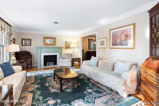 living room with wood-type flooring and ornamental molding