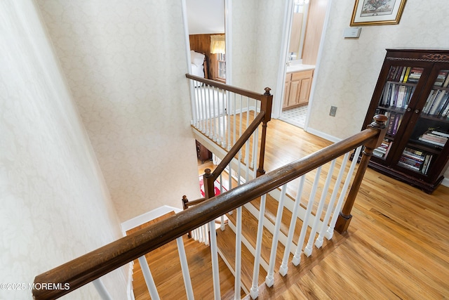 stairs with wood-type flooring