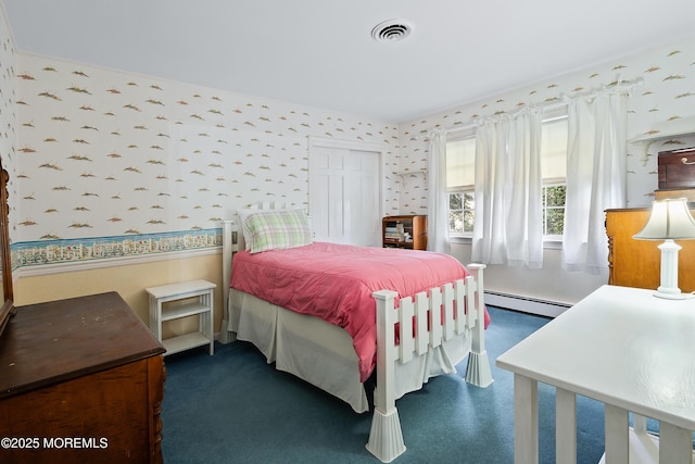 bedroom featuring a baseboard heating unit