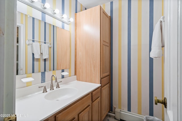 bathroom with vanity and a baseboard heating unit