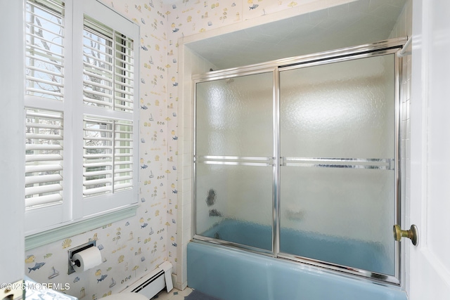 bathroom with bath / shower combo with glass door