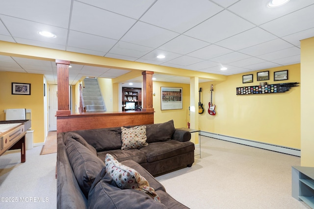 living room with light carpet and baseboard heating