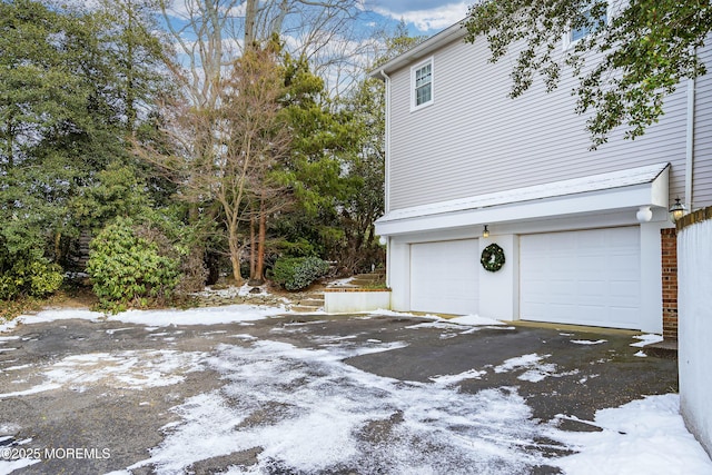 view of snow covered garage