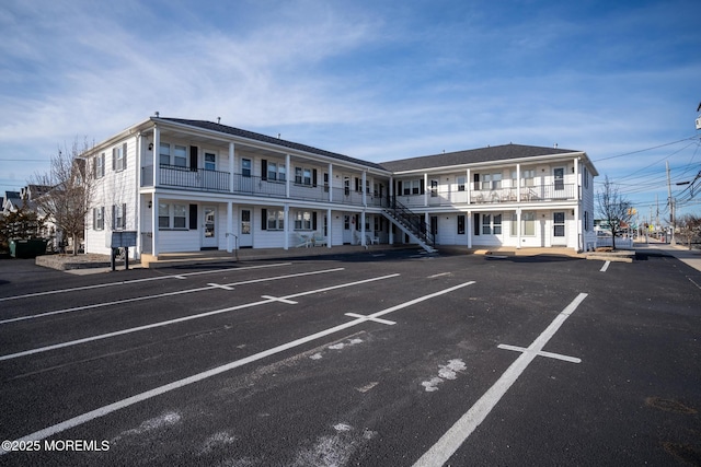 view of property featuring uncovered parking