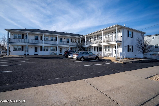 view of building exterior with uncovered parking