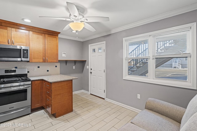 kitchen with light stone counters, brown cabinets, stainless steel appliances, light wood-style floors, and ornamental molding