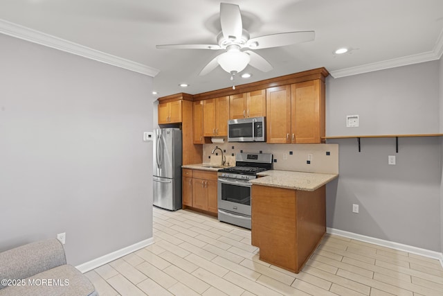 kitchen with appliances with stainless steel finishes, tasteful backsplash, sink, ceiling fan, and crown molding