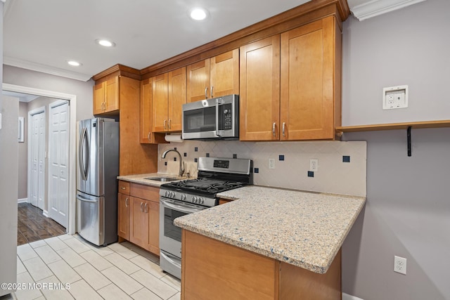 kitchen featuring brown cabinets, stainless steel appliances, tasteful backsplash, ornamental molding, and light stone countertops