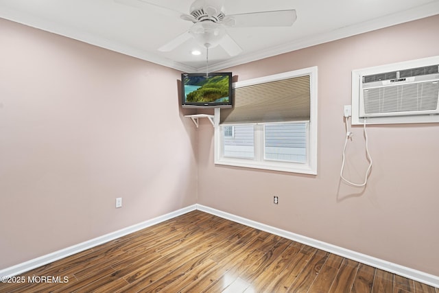 empty room featuring ornamental molding, ceiling fan, baseboards, and wood finished floors