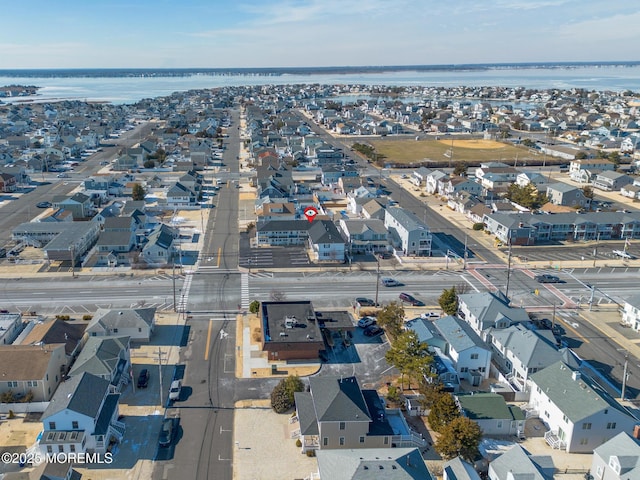 birds eye view of property featuring a residential view and a water view