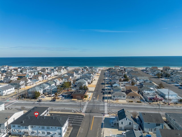 aerial view with a water view and a residential view