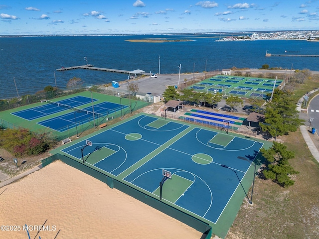 view of sport court featuring a water view