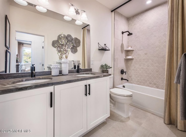 full bathroom featuring shower / tub combo, vanity, tile patterned floors, and toilet