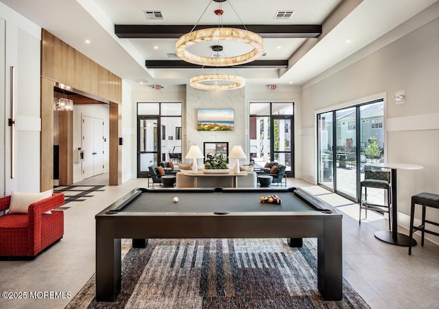 playroom with a tray ceiling and billiards