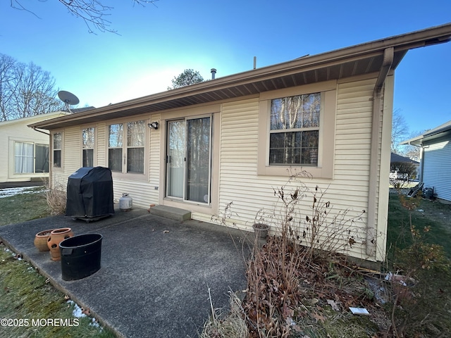 rear view of property with a patio area