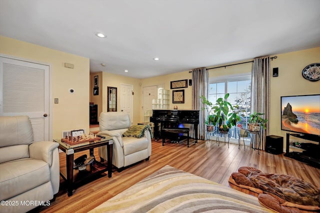 living room with light hardwood / wood-style flooring